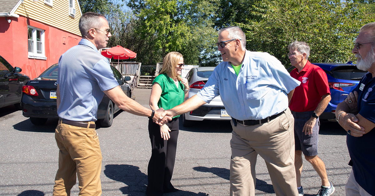 Senator Santarsiero greets Plumstead Township Director of Public Works Alan Bleam.